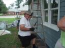 Associate Pastor Willie Rice painting the parsonage.
