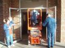 Jack, Dee & Marty trying to get the sissor lift into the building.